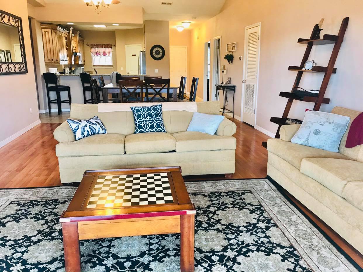 a living room filled with furniture and a chess board