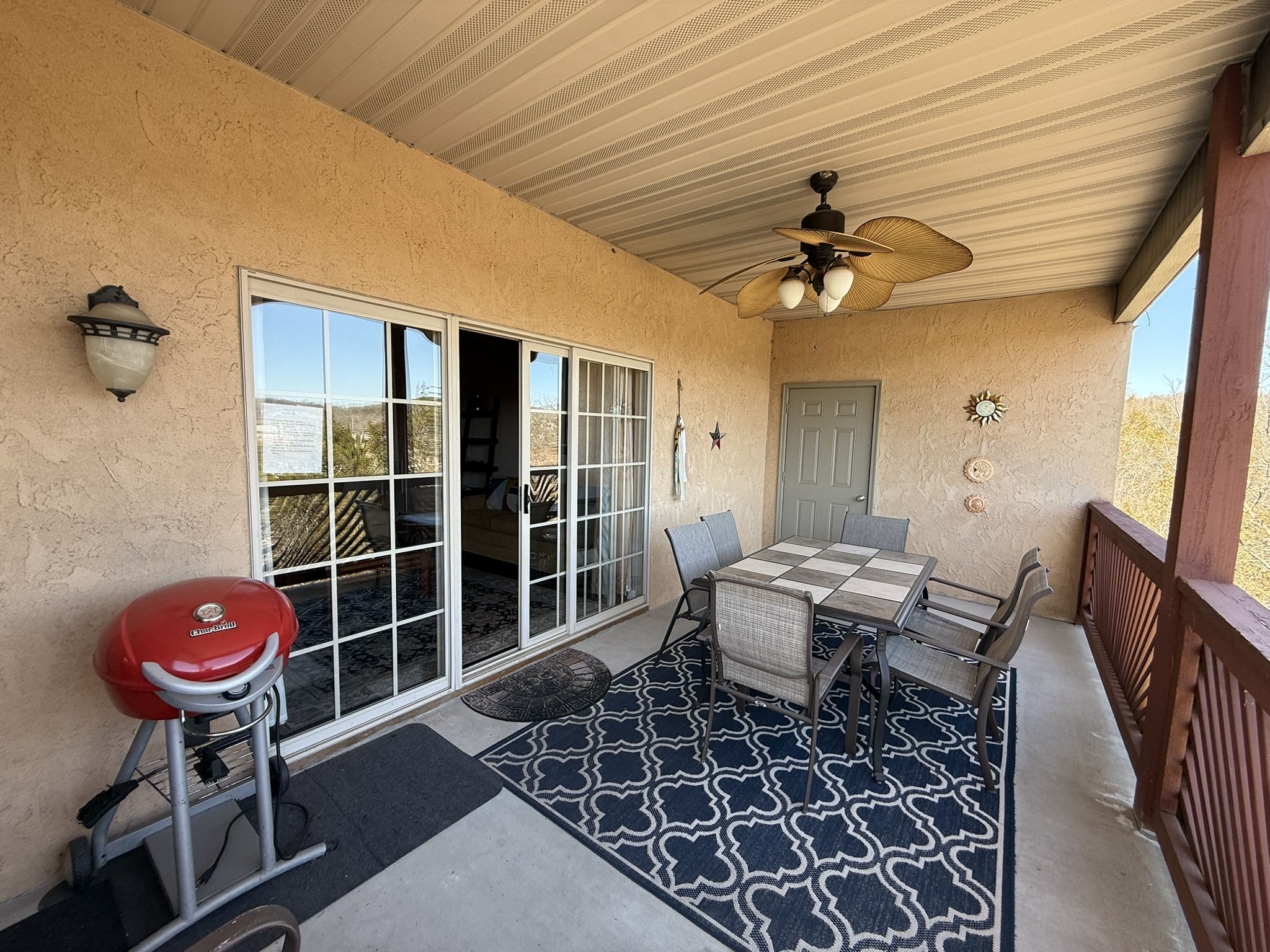 a patio with a table and chairs on it