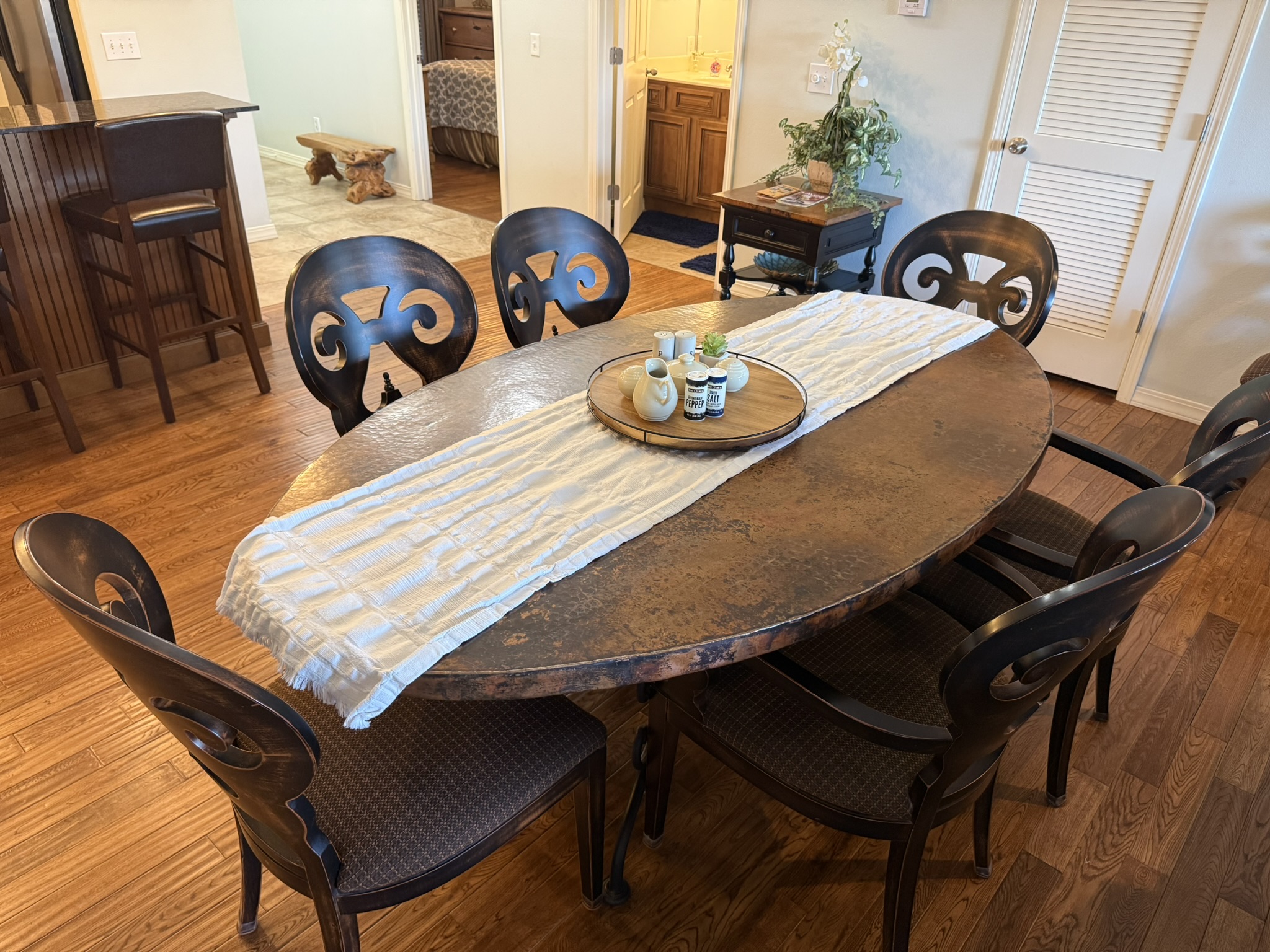 a dining room table with a plate on top of it