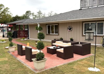 a house with a lot of furniture in front of it