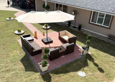 a patio with a table and chairs and an umbrella