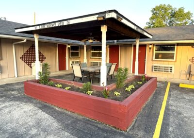 a building with a patio and a table and chairs