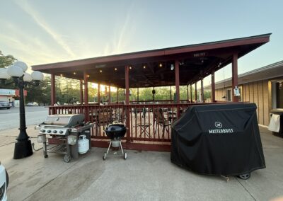 a bbq with a grill on the side of it